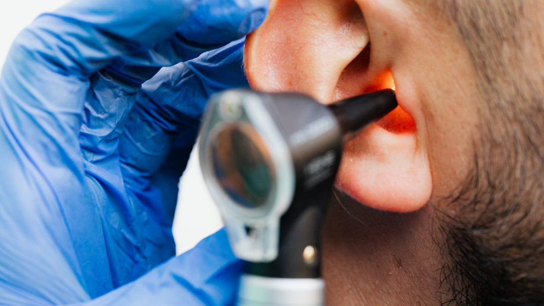 Doctor checks for Swimmer's Ear infection 
