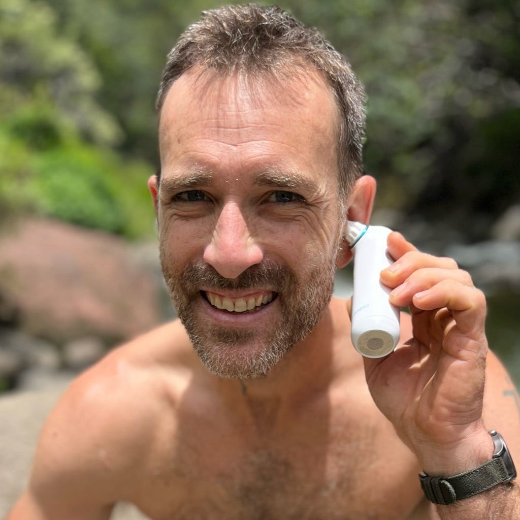 Swimmer uses the Whisper Ear Dryer to remove stuck water from his ears and prevent swimmer's ear infections.